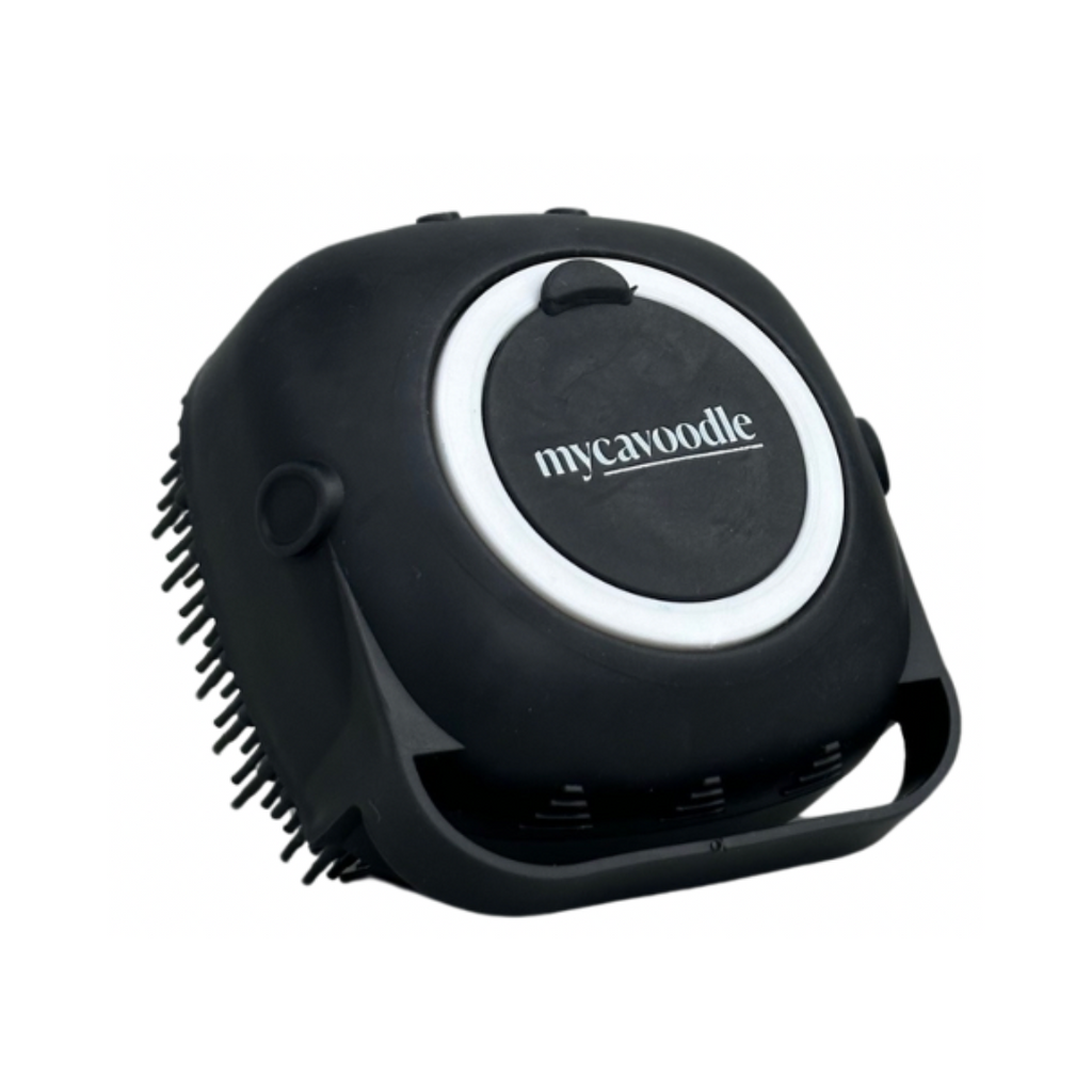 A black silicone shampoo brush with a white circular handle featuring the 'mycavoodle' brand name.