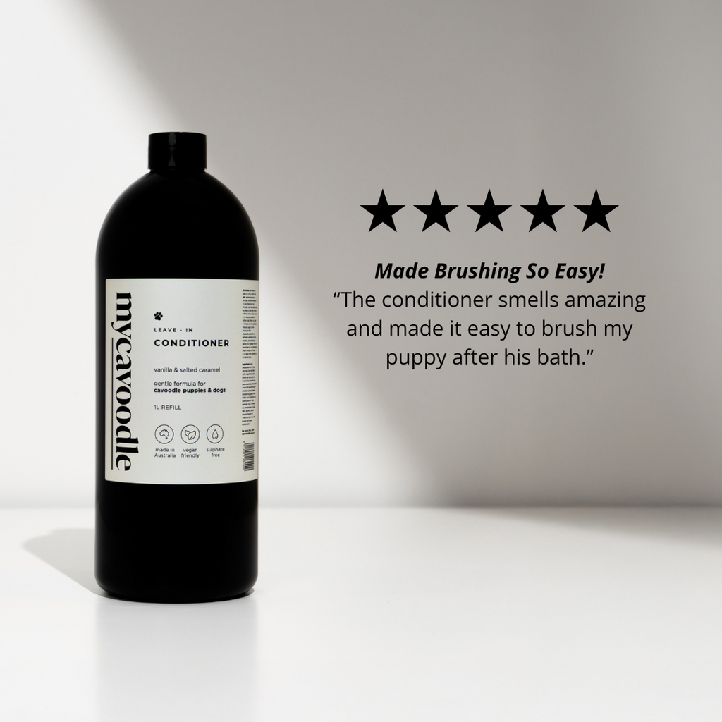 Bottle of dog wash conditioner with a five-star rating and customer review on a white background.